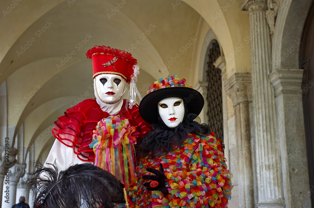 Venetian costume attends Carnival of Venice.