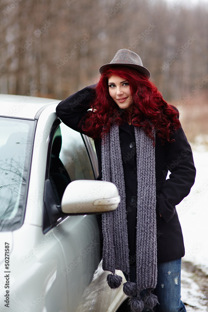 Young girl standing next to her car Young girl standing next to her car