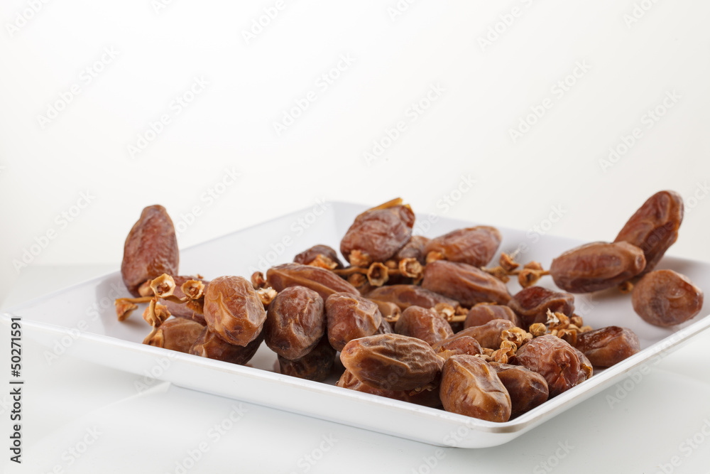 Date fruits on white background