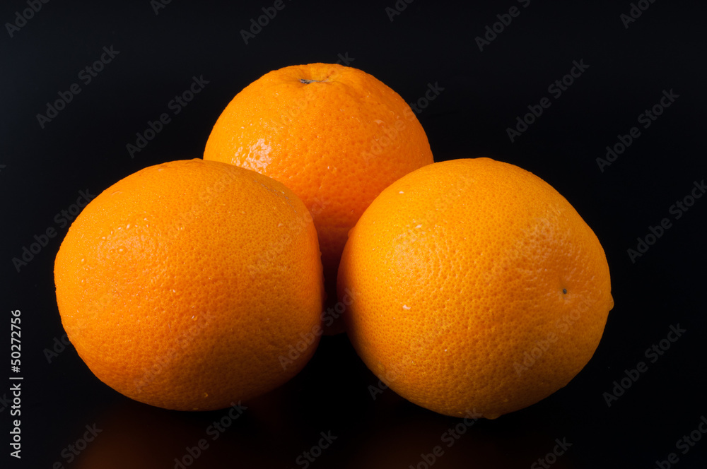 Ripe orange isolated on black background Ripe orange isolated on black background