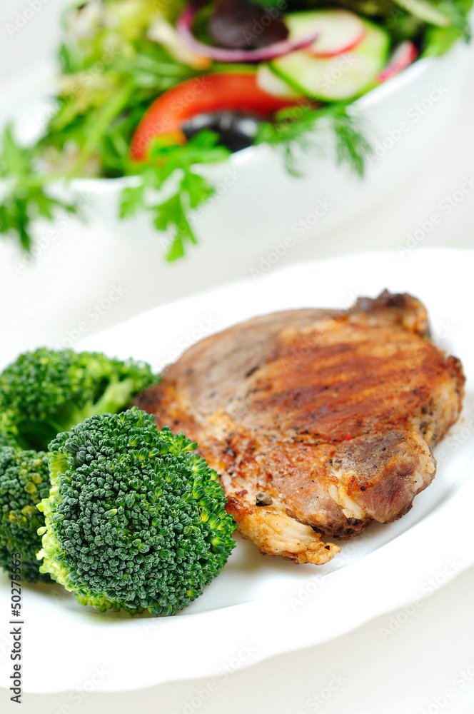 Grilled meat with salad