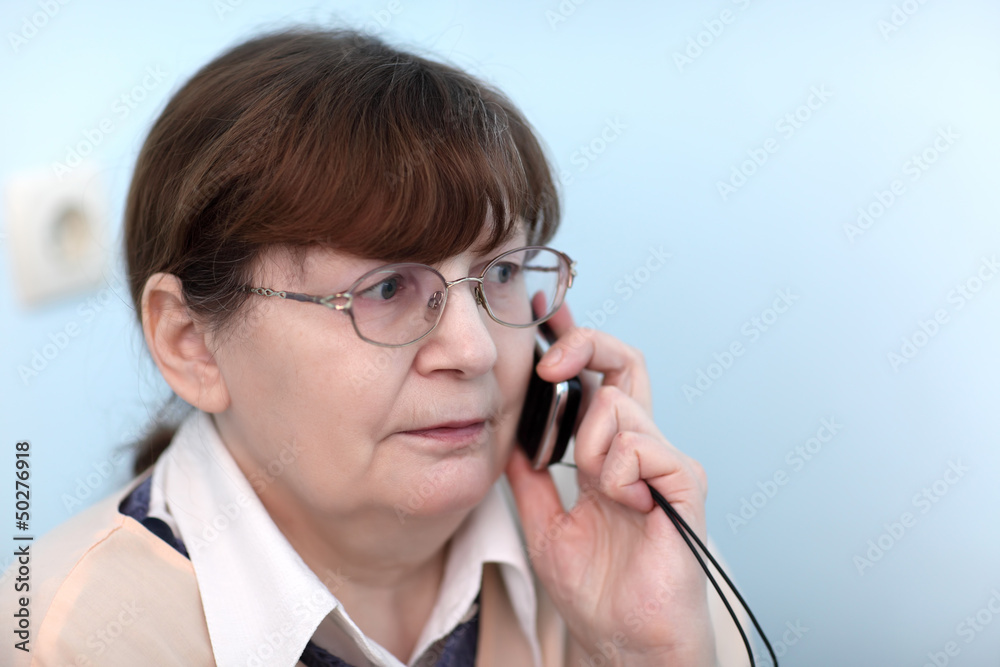 Serious woman with mobile phone Serious woman with mobile phone