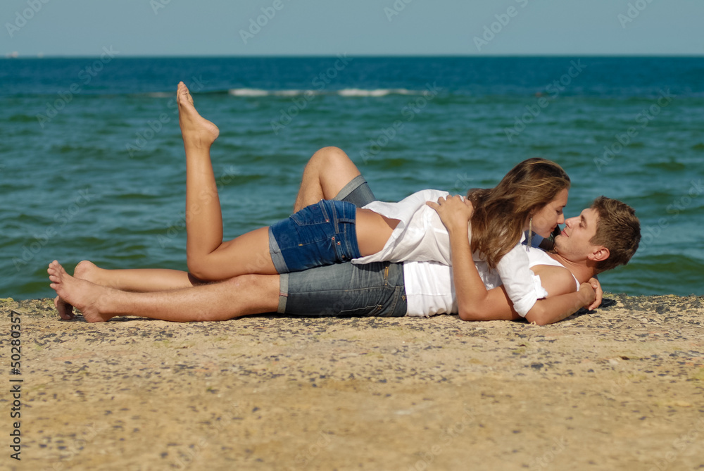 Young couple loving & kissing on the sea side