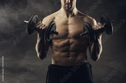 Exercising biceps with dumbbells