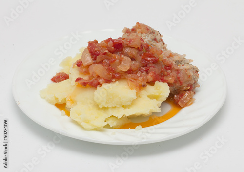 cutlet with potatoes in tomato sauce