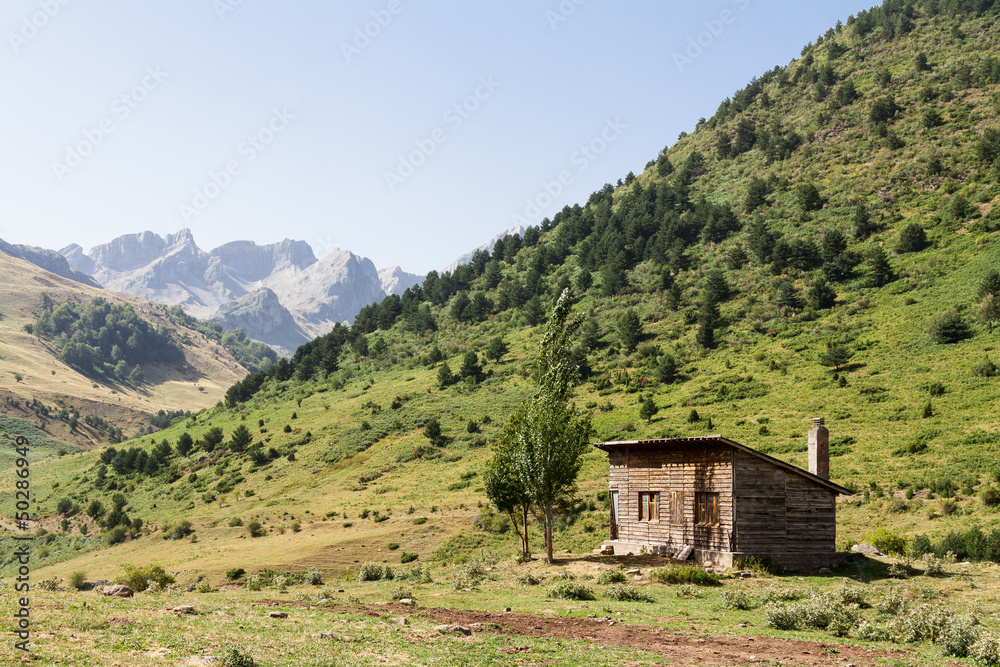 Mountain shelter with beautiful mountains in the background