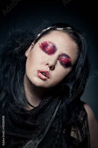 portrait of young brunette woman with closed eyes fashion makeup