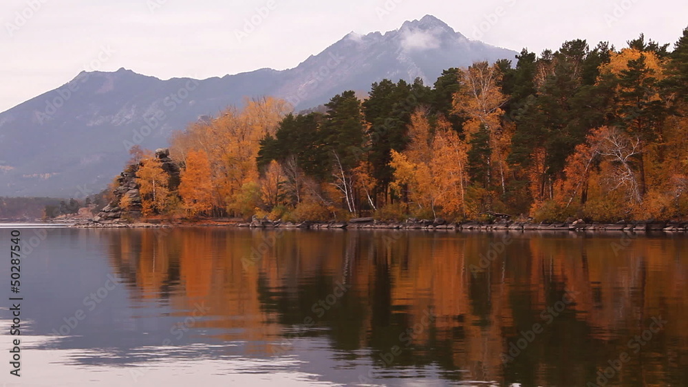 The autumn landscape with reflection in water in Burabay. The autumn landscape with reflection in water in Burabay.