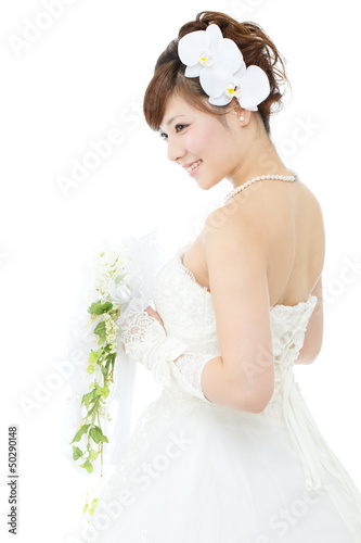 Beautiful asian woman dressed as a bride on white background