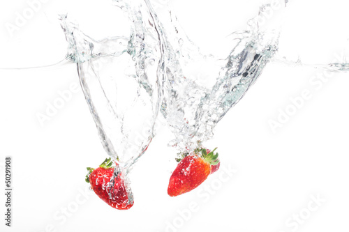 Two strawberries in water