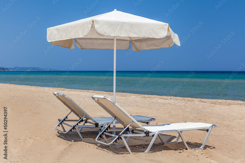 sun beds and sun umbrella on the beach
