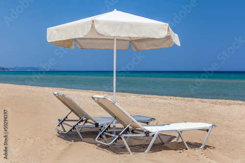 sun beds and sun umbrella on the beach