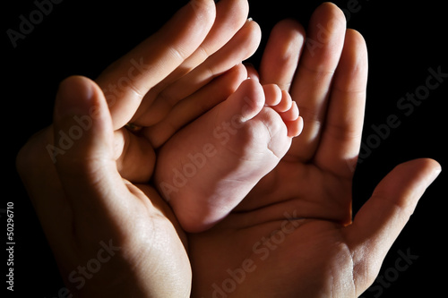 Hands Holding Baby Foot