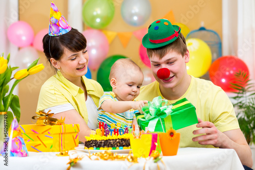 family celebrating first bi...