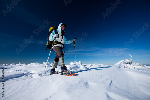 Hiker in winter mountains