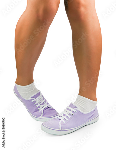 Legs of shy girl at white background