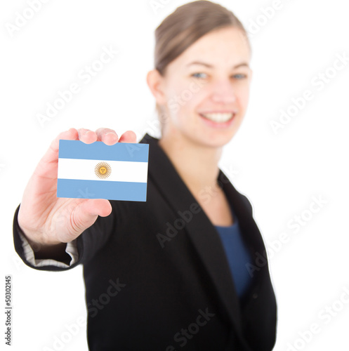 business woman holding a card with the Argentinian flag