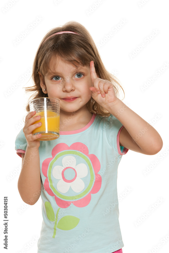 Clever girl with a glass of orange juice Clever girl with a glass of orange juice