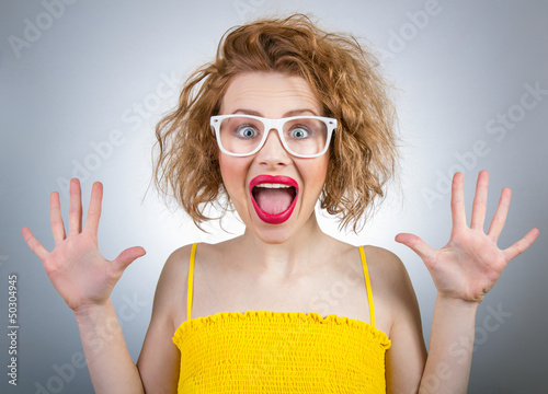 Happy surprised woman screaming with open hands