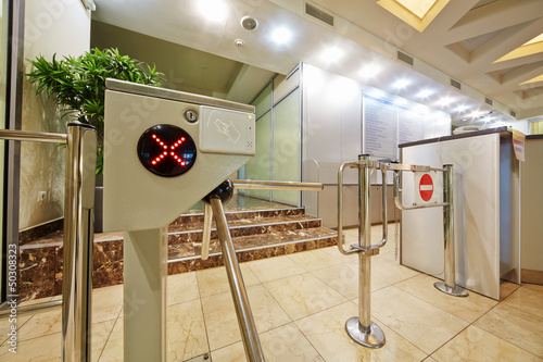 Entrance at building equipped with turnstile photo
