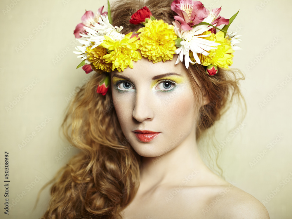 Beautiful young woman with delicate flowers in their hair