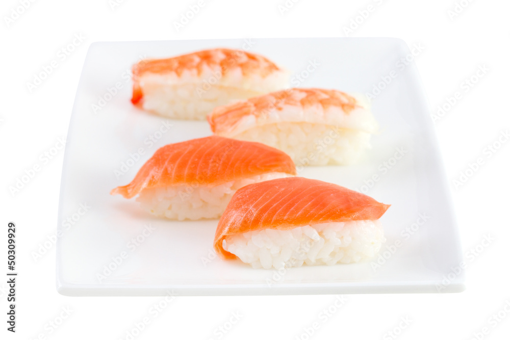 sushi with salmon on the plate on white background