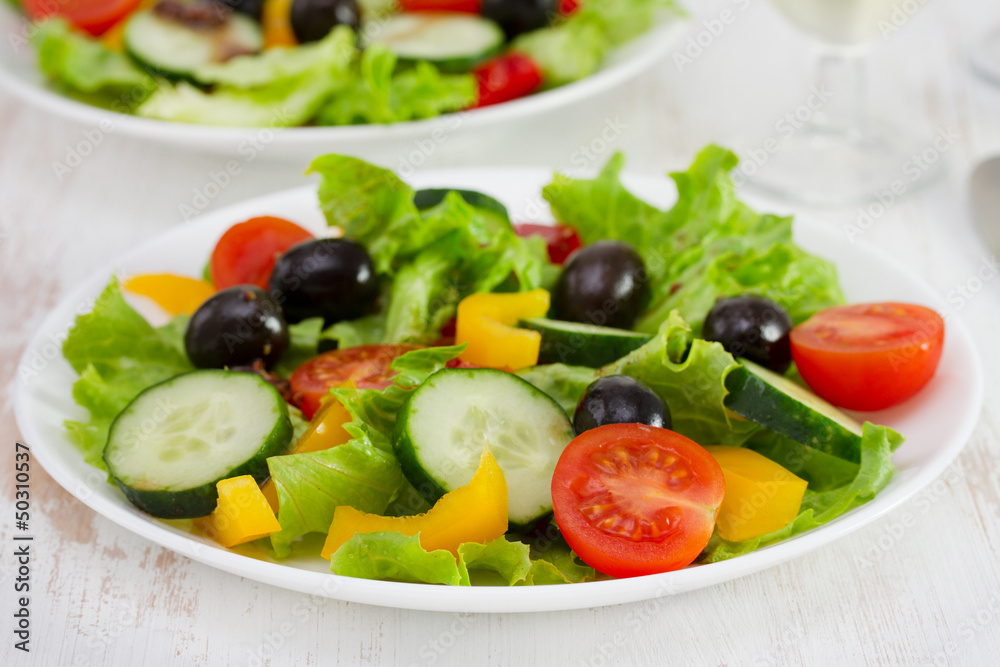 vegetable salad on the plates