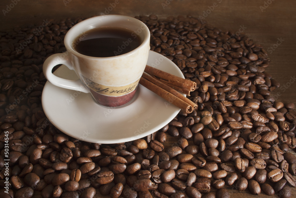 cup of coffee on a background coffee beans and brown wooden boar cup of coffee on a background coffee beans and brown wooden boar
