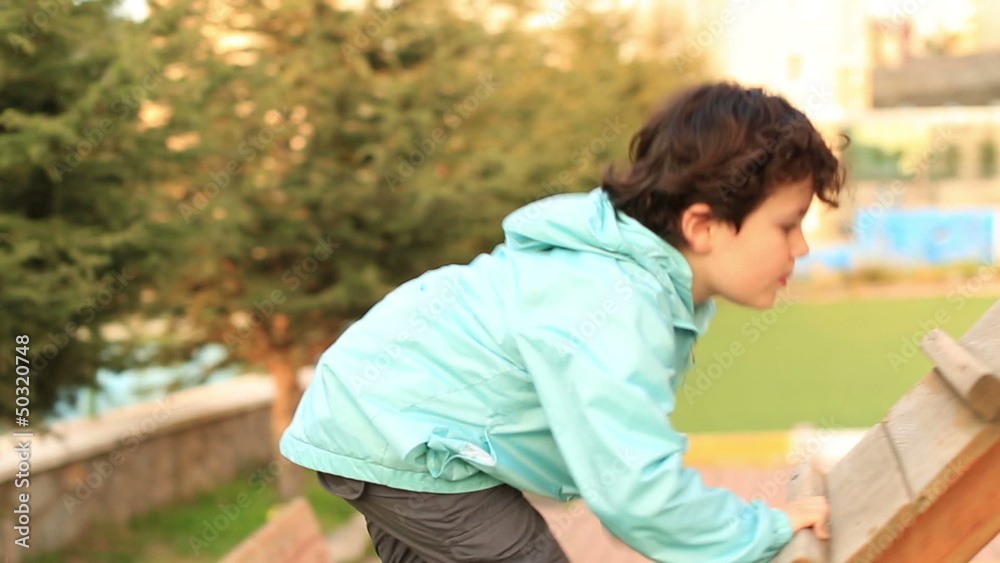 little child climbs in the playground, steady cam shoot little child climbs in the playground, steady cam shoot