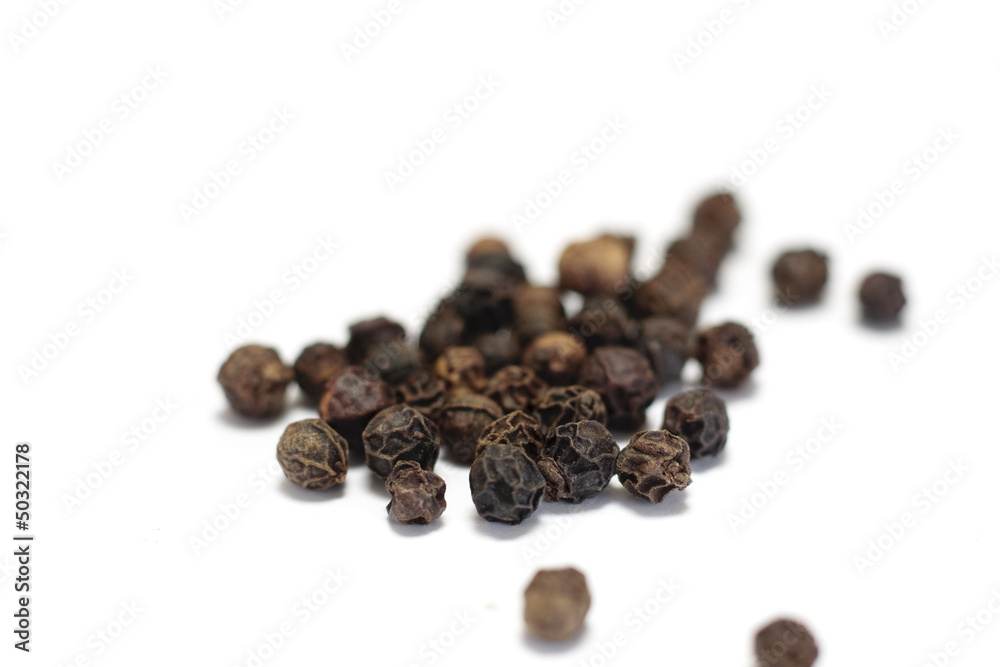 Isolated black peppercorns Isolated black peppercorns
