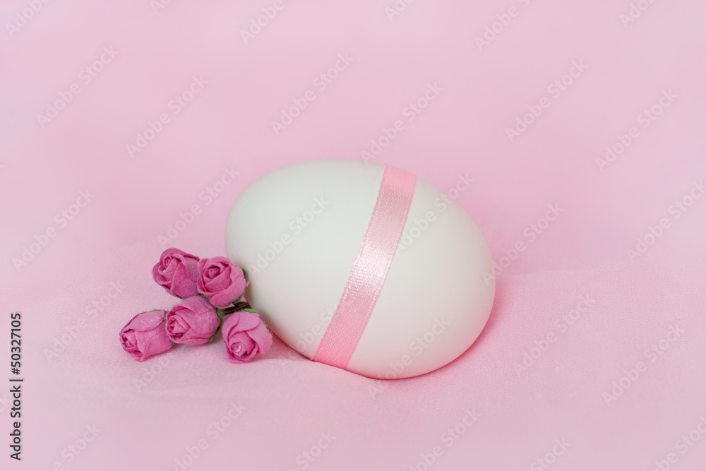 Colorful Easter eggs on rose background