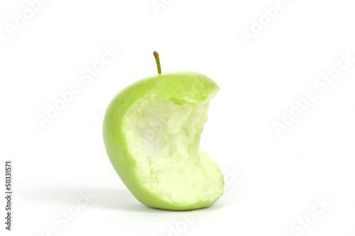 Green bitten apple isolated on white photo