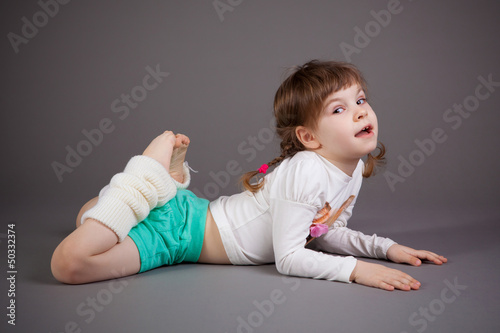 little girl on gray background