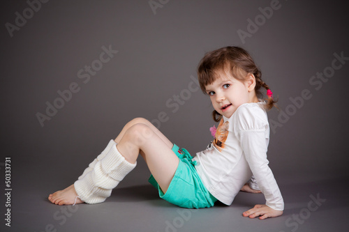 little girl on gray background