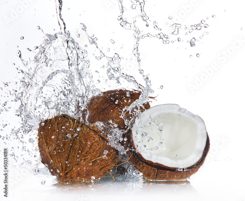 cracked coconut with splashing water