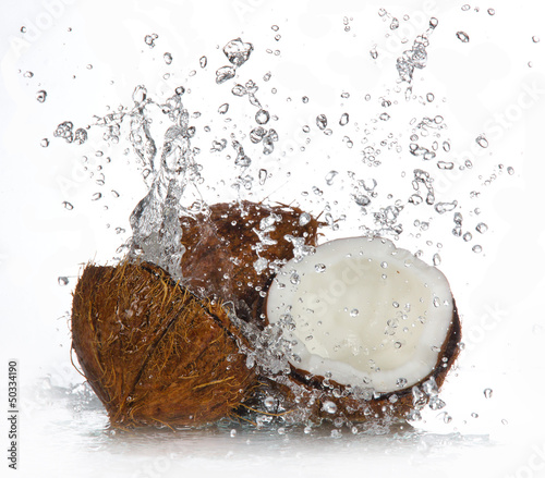 cracked coconut with splashing water