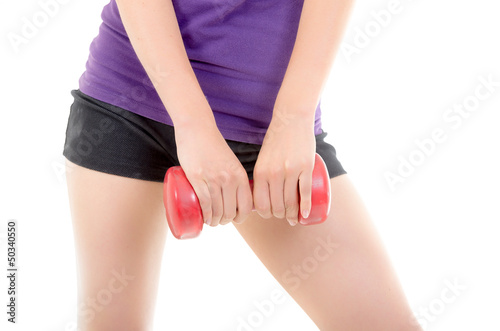 Woman doing fitness exercise with a hand weights.