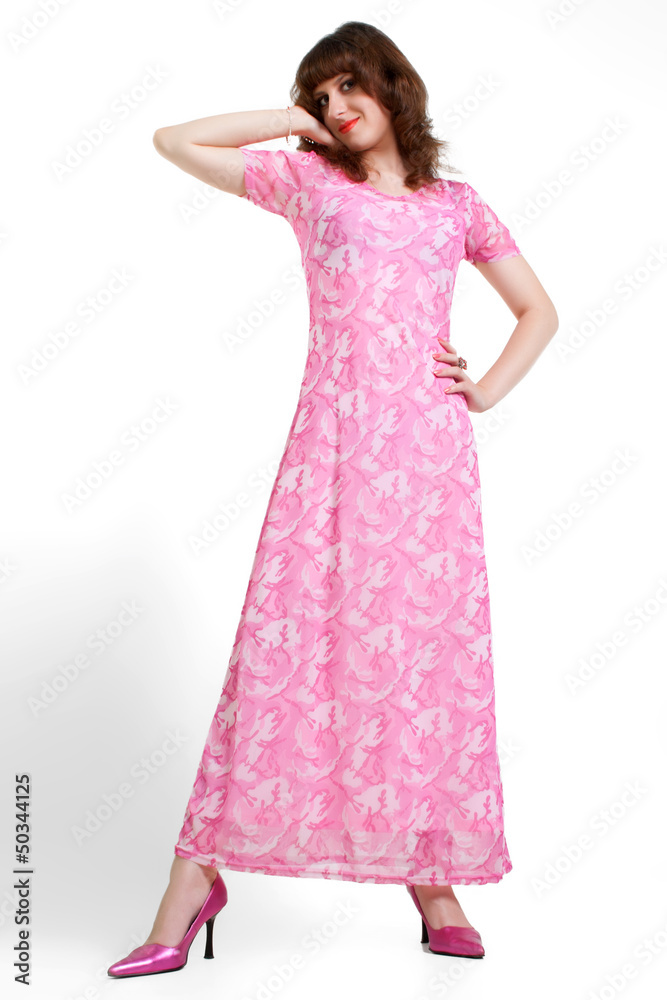 young brunette in a pink dress  isolated on white background