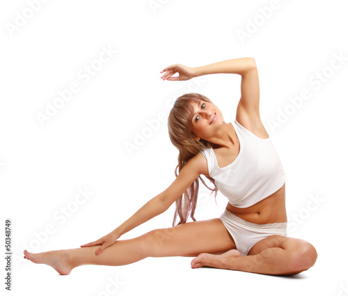 Portrait of a beautiful young woman doing yoga