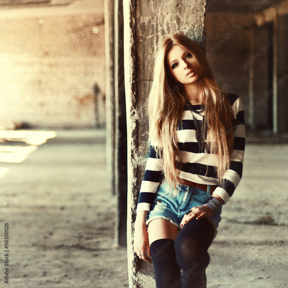Fototapeta premium Outdoor summer portrait of young pretty cute blonde girl