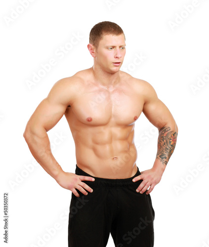 Healthy muscular young man. Isolated on white background