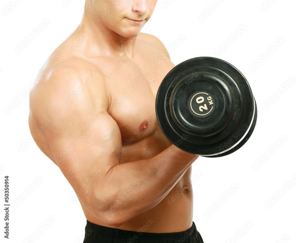 Handsome muscular man working out with