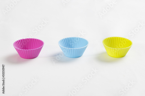 The image is a groups of cupcake molds