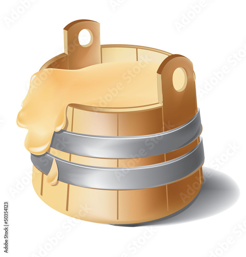 Wooden barrel of honey with metal silver clamps