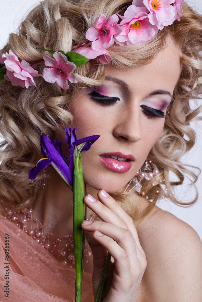 Blond beautiful woman with flowers