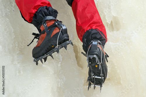 Ice climbing crampons in use closeup