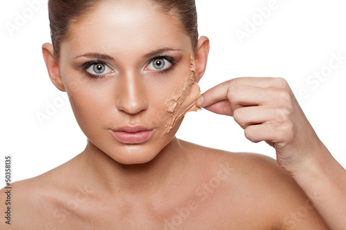 woman taking off her skin from face