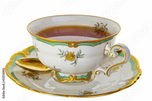 Tea in an antique tea cup. photo