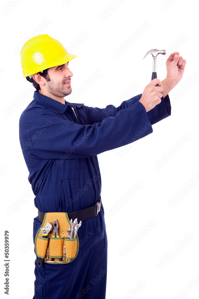 Young worker holding a hummer, isolated on white Young worker holding a hummer, isolated on white