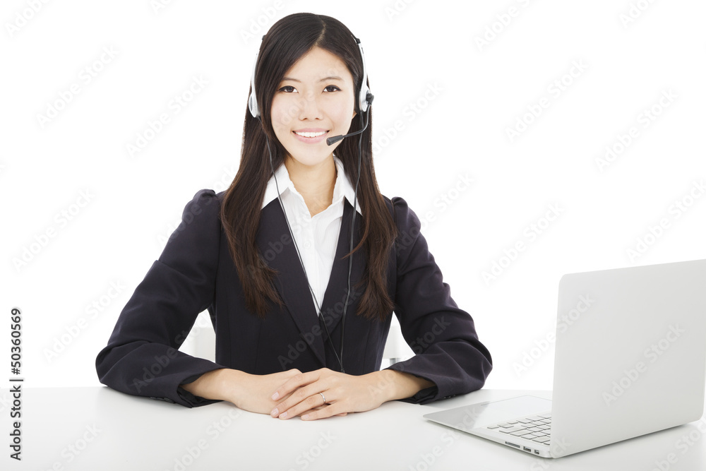Young smiling businesswoman with headset and laptop Young smiling businesswoman with headset and laptop